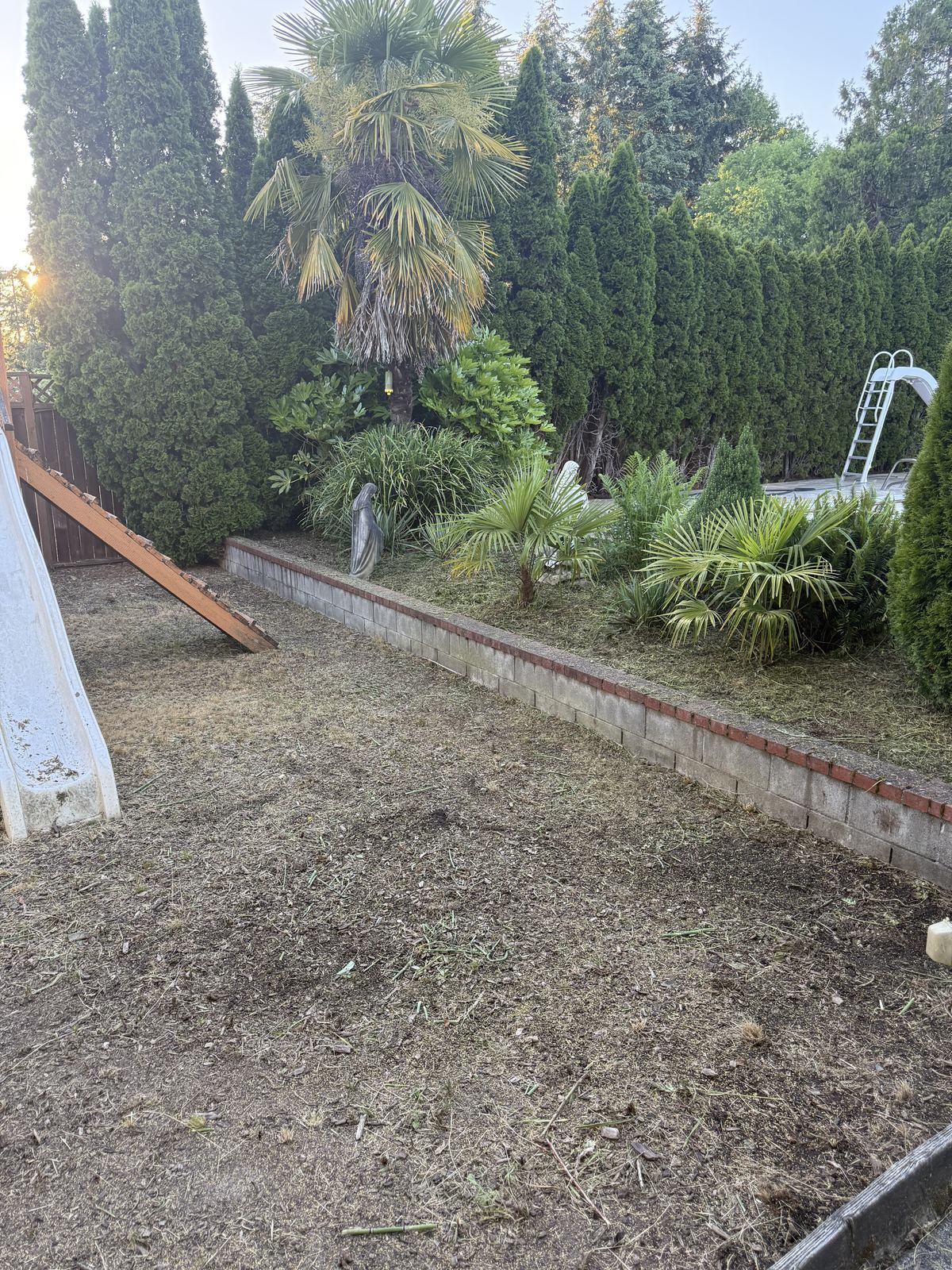 Backyard planting bed cleared and tidied